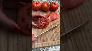 Cutting a tomato with a serrated knife [upl. by Nosbig]