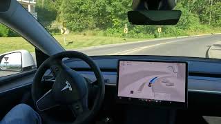 Tesla Full Self Driving handles roundabout and winding hill [upl. by Nivart29]