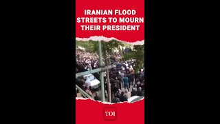 Watch Thousands Of Iranians Take To The Streets To Mourn President Raisis Death [upl. by Kurtzig113]