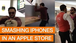 Angry Customer Smashes iPhones With Metal Ball In Apple Store [upl. by Zipnick]