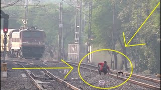 Man Walks In Front Of Running Train Sits On Railway Track Startles The Driver amp Then Waves At Him [upl. by Tilagram]