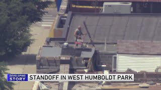 SWAT responds to man on rooftop of Humboldt Park building [upl. by Nylsoj990]