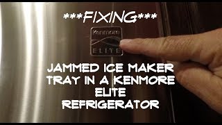 FIXING JAMMED ICE MAKER TRAY IN A KENMORE ELITE REFRIGERATOR [upl. by Farl]