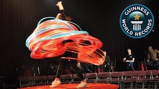 SPOTLIGHT  Most hula hoops spun simultaneously [upl. by Ardnuhsal841]