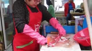 Skinning of live eels [upl. by Hsiwhem]