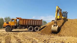 Loading of tenwheel dump truck by crawler excavator [upl. by Erlin977]