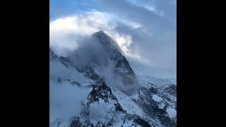 Clouds Drift Over the SnowCapped Mountain Peak [upl. by Sile]