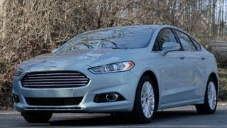 Car and Driver Tested  2013 Ford Fusion Hybrid  Review  CAR and DRIVER [upl. by Whitten]