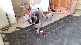 Herringbone Tile Floor Time lapse Install [upl. by Zak]