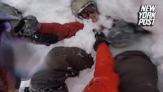 Snowboarder buried headfirst in snow after falling off cliff [upl. by Kerr509]