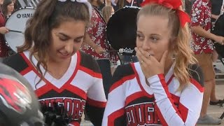 Football players kind gesture to cheerleader goes viral [upl. by Bautram]