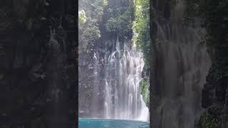 Person jumps from Tinago Falls rocks into water [upl. by Araas]