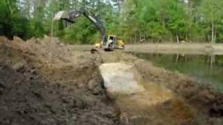 Excavator digging pond [upl. by Hsekin145]