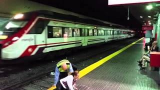 Renfe Train Torremolinos Station Spain Woman walks in front of train [upl. by Terrence]