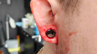 10mm biopsy punch tunnel dermal punch Extreme ear piercing streched ears Extreme Body Piercing [upl. by Aihcsrop]