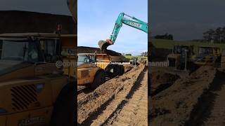 Kobelco excavator working loading Volvo dumptrucks shorts excavator excavators heavyequipment [upl. by Elwira]