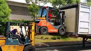 Movers Use Forklift to Lift Forklift [upl. by Eciuqram]