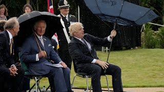 Boris Johnson struggles with umbrella at police memorial unveiling [upl. by Ajar]