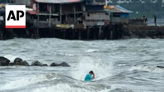 Floods in Philippines kill at least 9 and trap others on roofs [upl. by Gnoh465]