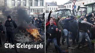 Police hose down eggthrowing farmers outside EU parliament in Brussels [upl. by Stein298]