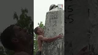 US Naval Academy cadets climb up greased monument in quirky annual tradition [upl. by Elleiand145]