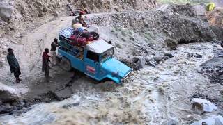 Jeep crossing creek that washed out roadPakistani Glacial Crossing [upl. by Rowland]