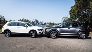 2019 Mazda CX5 vs 2019 Volkswagen Tiguan  Best Compact SUVs [upl. by Edylc]