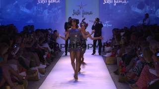 Performers dance on the runway during the Luli Fama swimw [upl. by Adahsar]