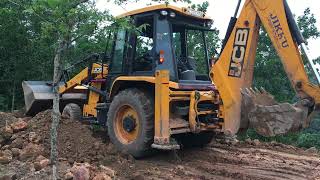 jcb 3dx levelling land by pushing soil using fronthoe [upl. by Ayekan]