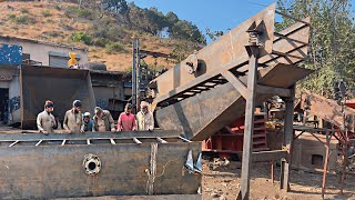 A local mechanic is making a new vibrating screen for a crushing plant from old iron sheets [upl. by Lael]