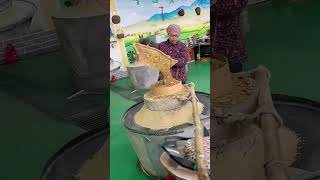 The process of grinding grains into powder with stone mills [upl. by Anirbac534]