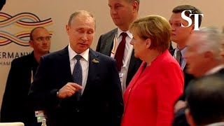 Angela Merkel gives Vladimir Putin epic eye roll [upl. by Clarkin]