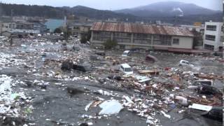 Tsunami in Kesennuma city ascending the Okawa river [upl. by Nilrev]