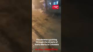 Floodwaters gushing through the streets of Santa Marta in ColombiaFlood SouthAmerica SantaMarta [upl. by Barnes]