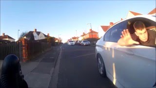 Driver leans out of car window and attempts to push cyclist off [upl. by Ahsina]