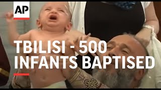 500 infants baptised in mass Orthodox ceremony [upl. by Akimas]