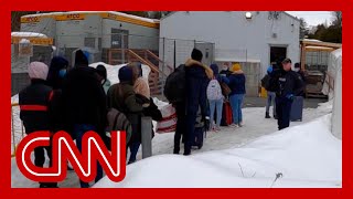 CNN follows migrants illegally entering Canada from New York road [upl. by Livvyy]