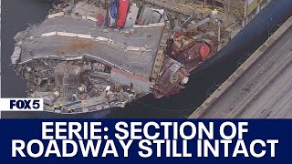 Baltimore Key Bridge collapse Section of roadway that fell remains unbroken across container ship [upl. by Nileve855]