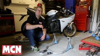 How to Use a paddock stand  Products  Motorcyclenewscom [upl. by Eenrahc]