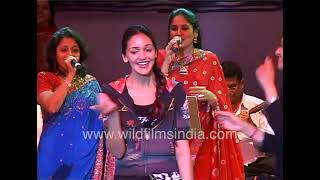 Esha Deol twirls and dances on stage in blue jeans black leather boots and a floral emblazoned top [upl. by Anait806]