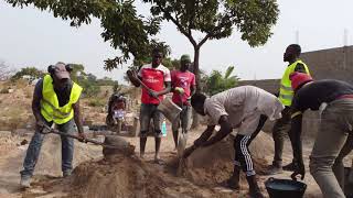 Rammed Earth Building In Ghana  From Mixing To Ramming [upl. by Aicener]