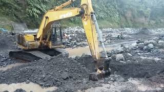 between the rocks the excavator scrapes the sand [upl. by Caria348]