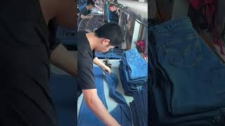 Factory workers ironing and shaping jeans on an assembly linehandmade shorts [upl. by Ylrebmek681]