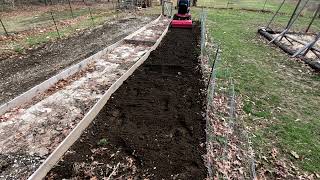 Tilling up the garden with my Wheel Horse C120 tractor [upl. by Notlef]