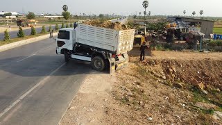 Technique filling land Next to the road Use D31P KOMATSU Dozer With Small Dump Trucks [upl. by Darrick]