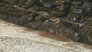 Worst tidal surge in 60 years batters UK east coast and drags homes into the sea [upl. by Destinee]