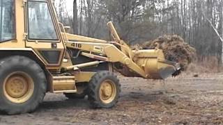 Caterpiller 416 Backhoe Loading Moss in Walking Floor Trailer [upl. by Graner]