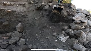 Dig the sand up to the depth of the excavators bucket arm and cover it with large stones part 1 [upl. by Nosauq700]