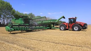 Harvest time in Germany with Case IH Steiger 450 HD  JampM 1326 grain cart and John Deere combines [upl. by Wenonah]