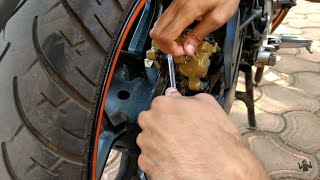 How To Change Brake Pads Of Bike Hindi Rear Disc Brake Pads Change Bajaj Pulsar 220 NS200 AS200 [upl. by Htieh]